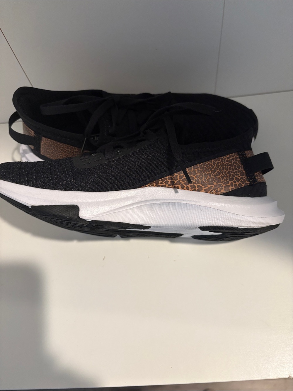 New Balance Black Athletic Sneakers with Bronze Heel Detail